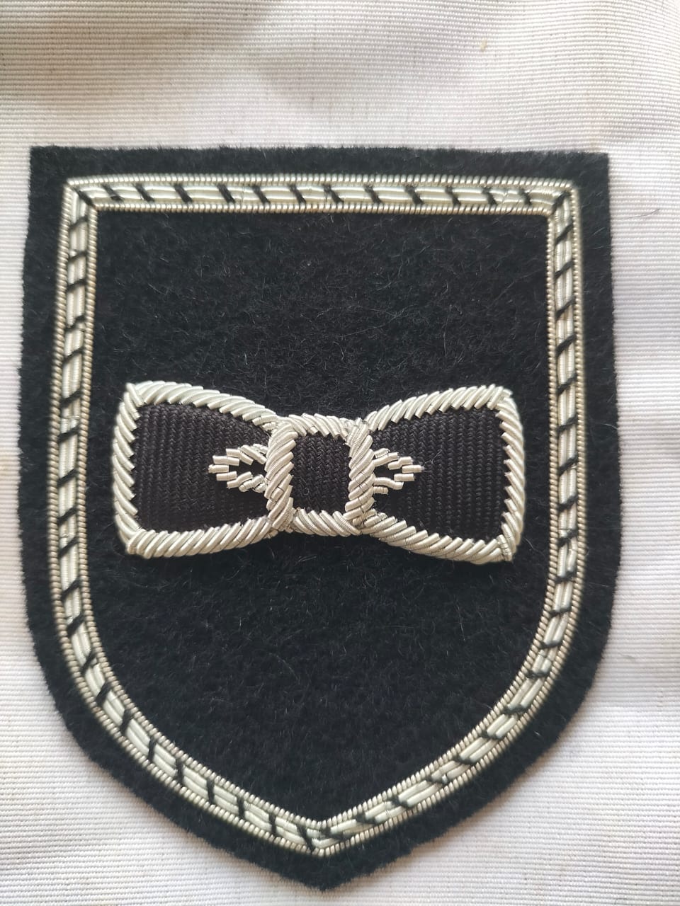 https://www.raabmagroups.com/products/hand-embroidery/aprons-1/hand-embroidery-silver-bullion-wire-badges-supplier-handmade-embroidery-patches-maker-bullion-wire-shield-badges-manufacturer-high-quality-cheap-price